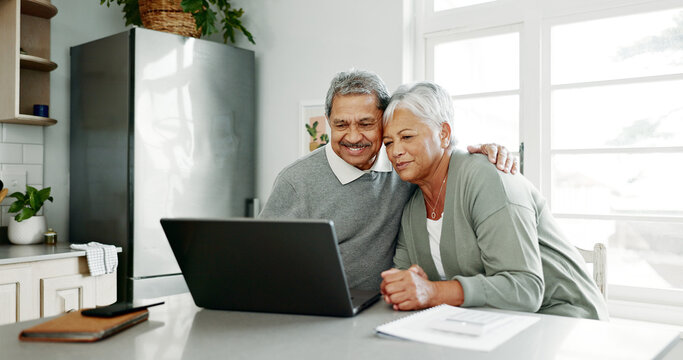 Senior, happy couple and hug with documents on laptop for retirement, finance or pension fund in kitchen at home. Elderly man, woman or lovers with smile on computer for embrace or financial planning - Powered by Adobe