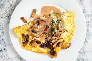 omelet with mushrooms and sauce