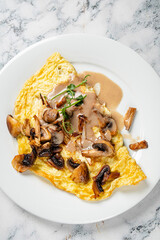 omelet with mushrooms and sauce