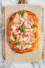 tasty pizza on the wooden board