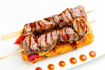beef kebab with sauce, and vegetables