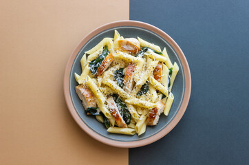 Pasta alfredo with chicken, spinach and cheese. Italian food.