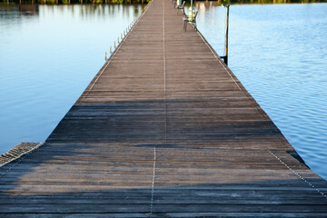 Naklejka premium a floating pier or bridge for crossing a lake and fishing from the pier