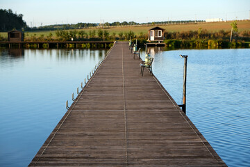 Fototapeta premium a floating pier or bridge for crossing a lake and fishing from the pier