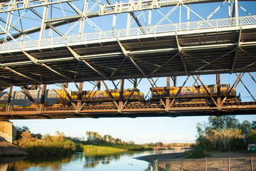 Obraz premium Train passing over water on bridge Yuma, AZ