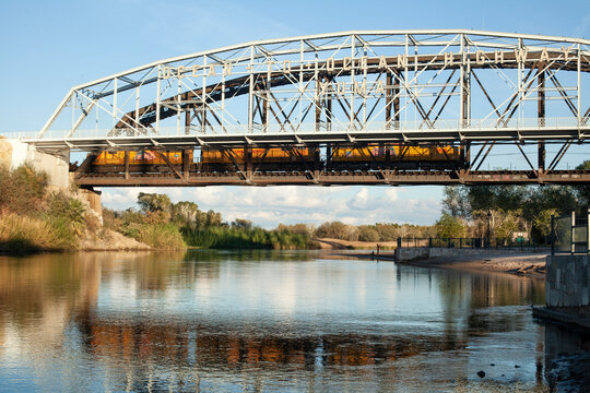 A train crosses over the Colorado river in Yuma, AZ