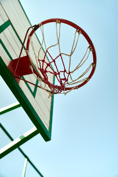 A basketball hoop and blue sky