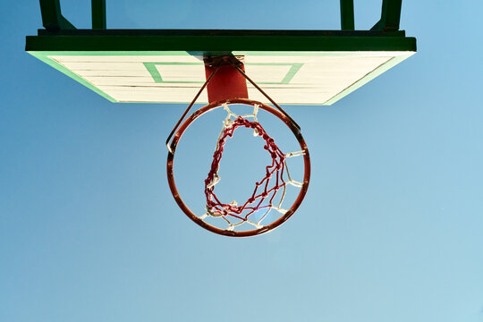 A basketball hoop and blue sky
