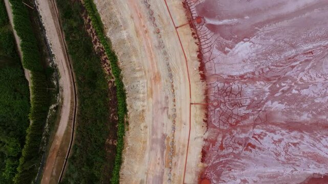 Red Mud Pond In Xove. aerial topdown shot