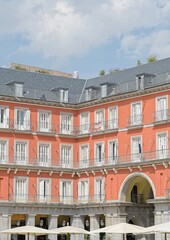 Arch of the Plaza Mayor with umbrellas in summer