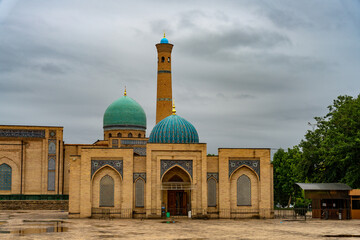 A large building with a blue dome and a tall tower
