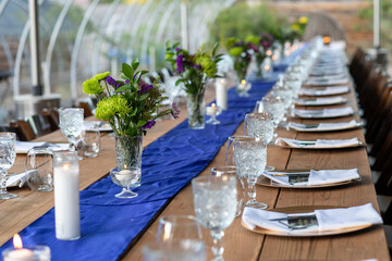 Long communal table set for dinner service