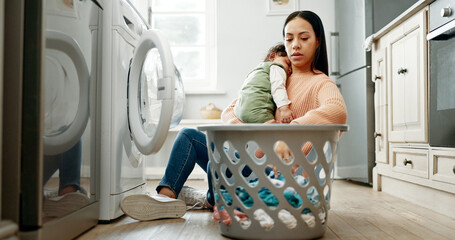 Mother, baby and basket in kitchen for laundry, housekeeping and motherhood in house with sleeping...