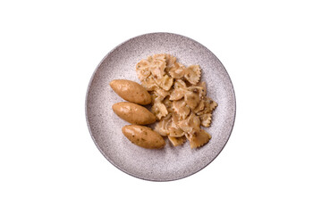 Fish or meat quenelles with delicate mushroom sauce, salt and spices