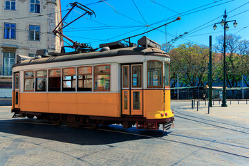 Lisbon yellow tram on a street. Portugal
