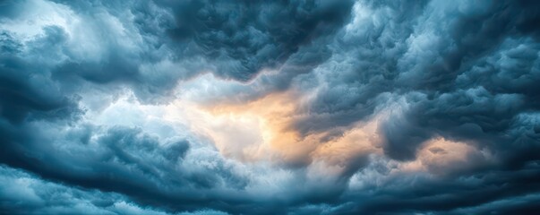 Obraz premium Dramatic storm clouds gather in the sky, showcasing vibrant colors and intricate textures, evoking emotion and wonder in nature.
