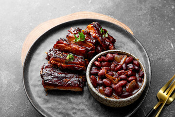 Roasted Pork Ribs in BBQ Sauce with Red Beans in the plate