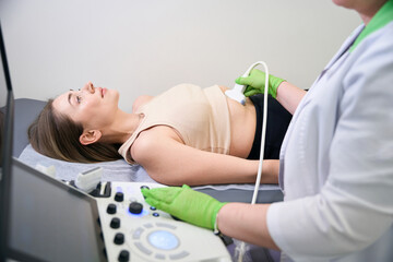 Female patient lying down during abdominal ultrasound scan
