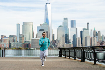 Mature man doing sport on street. Runners sprinting outdoors. Sport man training in a urban area,...