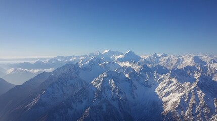 Obraz premium Snowy Mountain Range Under Blue Sky