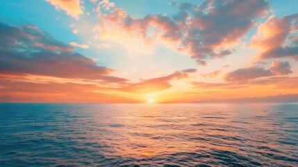 Fototapeta premium Tranquil sea at sunset with stunning sky. Serene ocean and sky view. Vivid horizon above the sea.