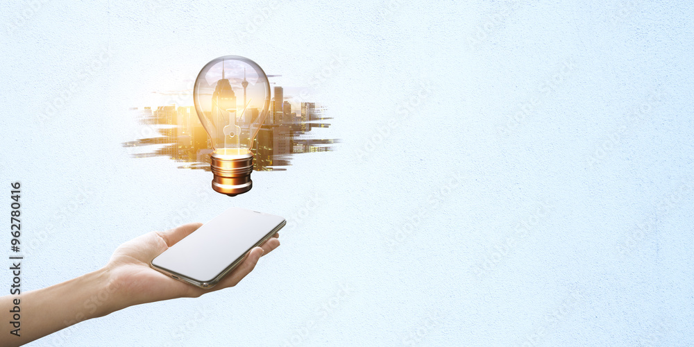 Poster hand holding smartphone with a lightbulb and cityscape emerging from the screen on a light blue back