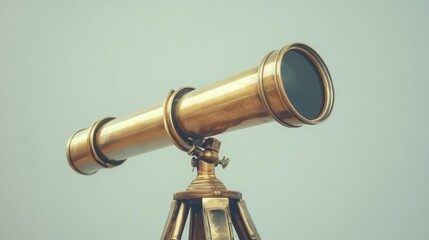 A vintage brass telescope mounted on a wooden tripod, used for stargazing or observing distant objects.