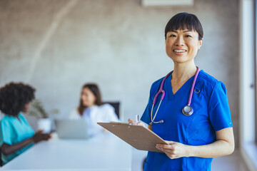 Smiling Nurse with Clipboard in Medical Office Setting