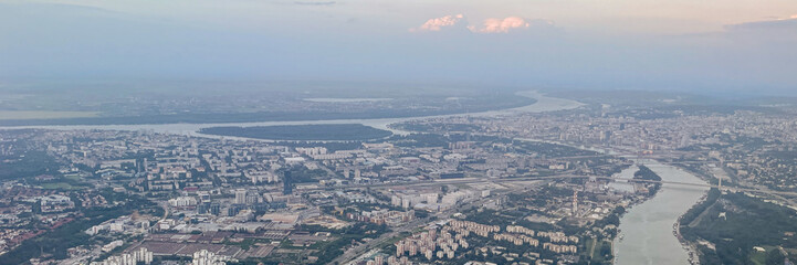 Aerial view of Belgrade, Serbia, highlighting the confluence of the Sava and Danube rivers during sunrise, ideal for travel and tourism concepts