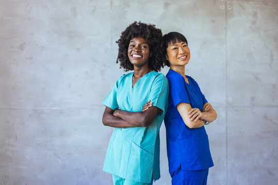 Confident Nurses Standing Back to Back in Hospital Setting