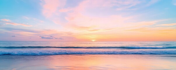 Obraz premium Serene seascape with soft pink and blue hues, showcasing a tranquil ocean horizon at sunset.