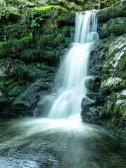 Fototapeta premium Waterfalls in the river Yera flowing through the mountains of the Pas valley.