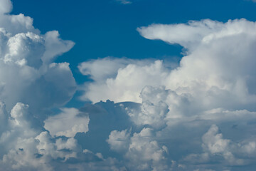  Beautiful white anime-looking clouds over a blue sky for the background.