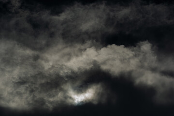 Smoke-looking clouds over a black background
