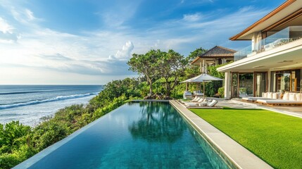 Fototapeta premium Luxury villa with a large garden and swimming pool, overlooking the ocean.