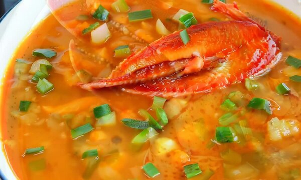 Creamy lobster bisque garnished with chives, Video