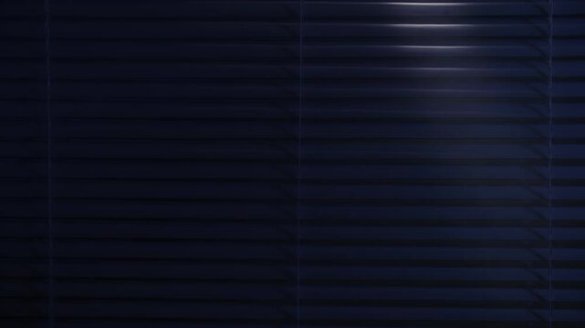in search of a criminal, a male thief with a flashlight illuminates the room through the blinds, close-up