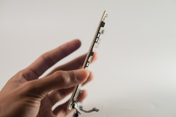 Hand Holding Thin Electronic Circuit Board