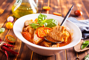 Homemade meat and vegetable stew or soup with tomato