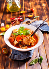 Homemade meat and vegetable stew or soup with tomato