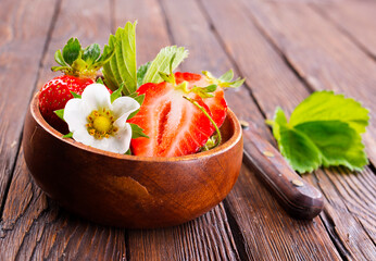 Close up of ripe organic strawberry food wooden table