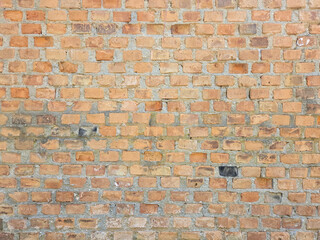 a wall of old and old bricks