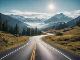Fototapeta premium Road in the mountains with sun and clouds in the blue sky.