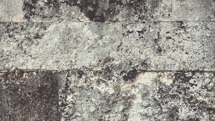 Stone Wall Pattern. Aged Worn Vintage Fence. Ancient Texture. Grunge background Toned Photo