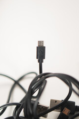 Tangled Black US B Cables on White Background