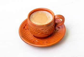 A cup of hot Milk tea or Dudh Cha in a traditional natural clay cup.