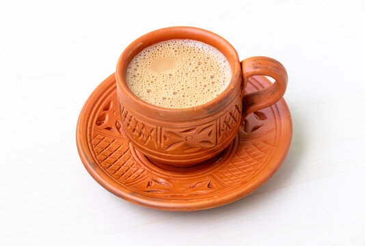 Hot milk tea or dudh cha served in a natural clay cup.