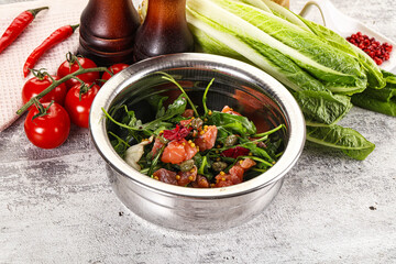 Salad with salmon and arugula