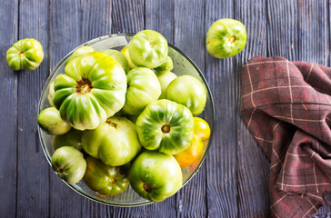 green tomatoes in glass bowl