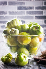 green tomatoes in glass bowl